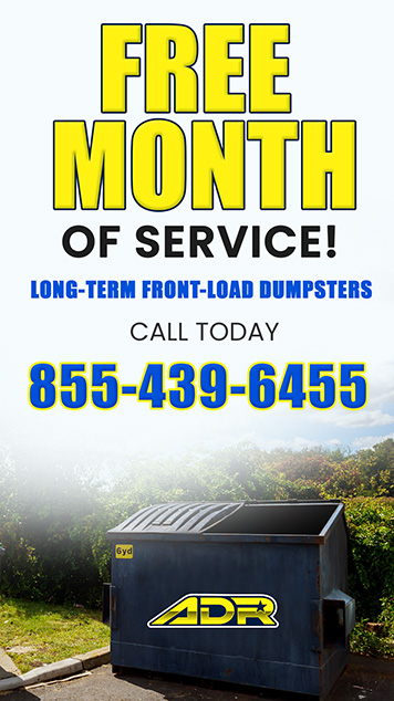 Large blue front-load dumpster with 'Free Month' text overlay